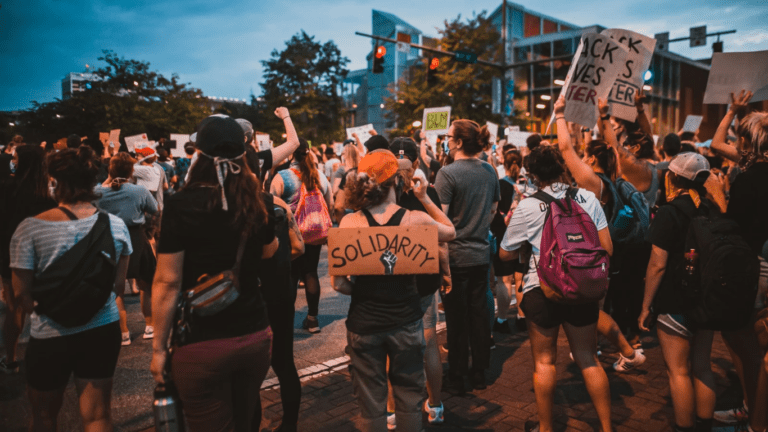 A crowd of people on a strike.